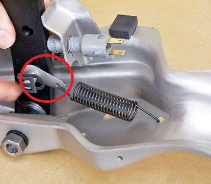 Picture of a 1964 - 1972 Chevelle / Nova Tear Drop Brake Pedal Return Spring Extension Eyelet Bracket Clip, Angle 2